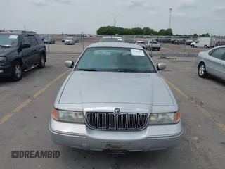 1999 Mercury Grand Marquis LS z VIN 2MEFM75W7XX659031, wystawiony jako IAAI lot #42362387 z przebiegiem 140 067 mil mil oraz . Historia ofert i sprzedaży dostępna na DreamBid. Obrazek 6.