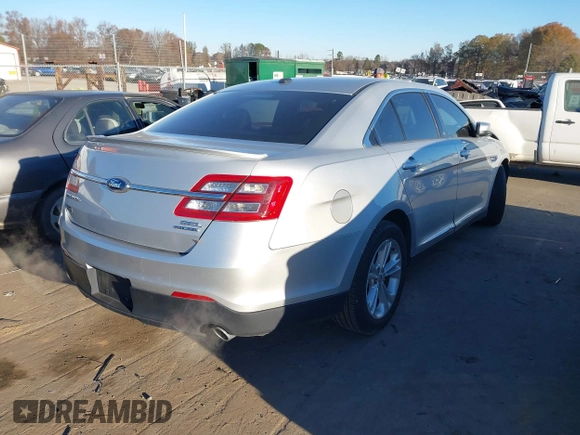 2014 Ford Taurus SEL z VIN 1FAHP2E87EG121069, wystawiony jako IAAI lot #41030422 z przebiegiem 138 043 mil mil oraz . Historia ofert i sprzedaży dostępna na DreamBid. Obrazek 4.