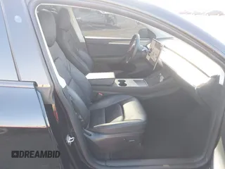 2023 Tesla Model Y Performance with VIN 7SAYGDEF4PF809308, listed as a IAAI auction lot 42056769 with 12,101 mi miles and . Bid and sale history available at DreamBid. Image 4.