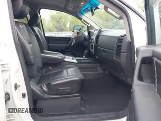 2014 Nissan Titan Pro-4X with VIN 1N6BA0ECXEN501915, listed as a IAAI auction lot 42097967 with 120,851 mi miles and . Bid and sale history available at DreamBid. Image 5.