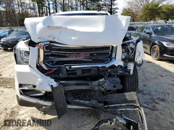 2015 GMC Yukon SLT with VIN 1GKS2BKC4FR143581, listed as a Copart auction lot 50591645 with 0 mi miles and Salvage Title. Bid and sale history available at carsss.com. Image 5.