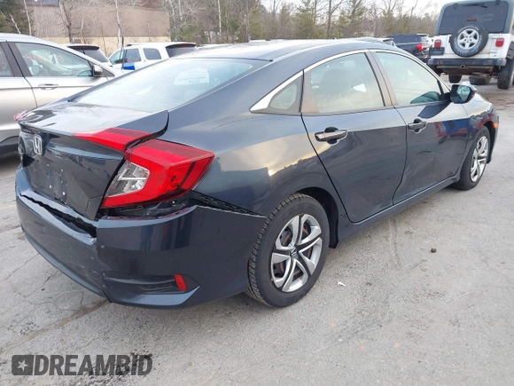 2017 Honda Civic LX z VIN 19XFC2F52HE028823, wystawiony jako IAAI lot #41312009 z przebiegiem 56 462 mil mil oraz . Historia ofert i sprzedaży dostępna na DreamBid. Obrazek 4.