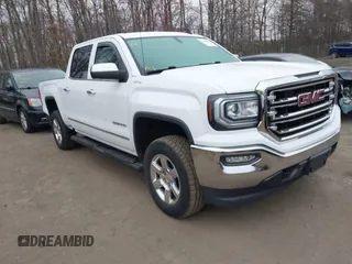 2018 GMC Sierra 1500 SLT z VIN 3GTU2NEC1JG402263, wystawiony jako IAAI lot #41786328 z przebiegiem 100 097 mil mil oraz . Historia ofert i sprzedaży dostępna na DreamBid. Obrazek 1.