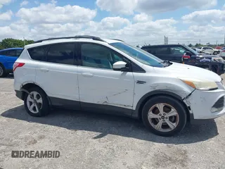 2013 Ford Escape SE with VIN 1FMCU0GX0DUC79223, listed as a IAAI auction lot 42077240 with 158,141 mi miles and . Bid and sale history available at DreamBid. Image 13.