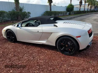 2012 Lamborghini Gallardo z VIN ZHWGU6BZ7CLA11933, wystawiony jako Copart lot #74679154 z przebiegiem Nie podano mil oraz Szkody całkowita. Historia ofert i sprzedaży dostępna na DreamBid. Obrazek 2.