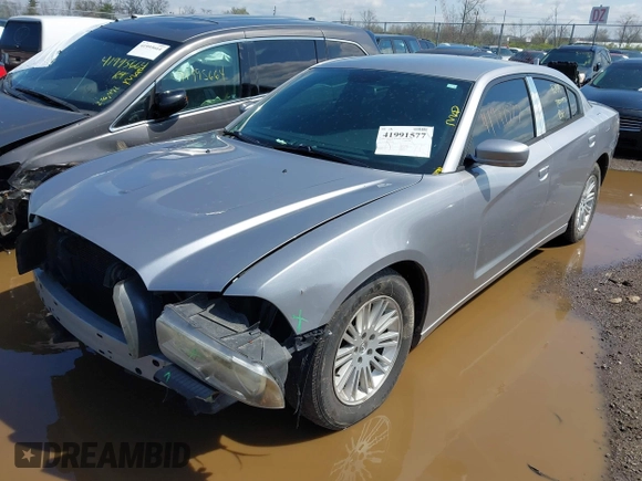 2013 Dodge Charger SE with VIN 2C3CDXBG7DH742812, listed as a IAAI auction lot 41991577 with 124,057 mi miles and . Bid and sale history available at DreamBid. Image 2.
