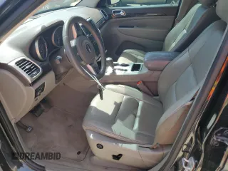 2013 Jeep Grand Cherokee Laredo with VIN 1C4RJEAG2DC519570, listed as a Copart auction lot 52066225 with 129,091 mi miles and Salvage Title. Bid and sale history available at carsss.com. Image 7.