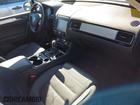 2016 Volkswagen Touareg Sport with VIN WVGEF9BP4GD012265, listed as a IAAI auction lot 41208383 with 69,205 mi miles and . Bid and sale history available at DreamBid. Image 5.