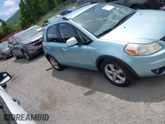 2009 Suzuki SX4 Touring AWD z VIN JS2YB417096201672, wystawiony jako IAAI lot #42209018 z przebiegiem 64 879 mil mil oraz . Historia ofert i sprzedaży dostępna na DreamBid. Obrazek 14.