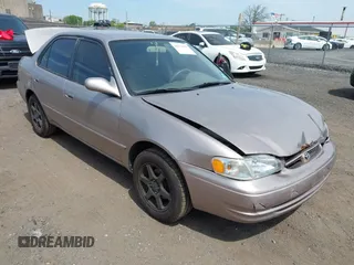 1999 Toyota Corolla VE z VIN 2T1BR12E2XC192065, wystawiony jako IAAI lot #42171501 z przebiegiem 115 894 mil mil oraz . Historia ofert i sprzedaży dostępna na DreamBid. Obrazek 1.