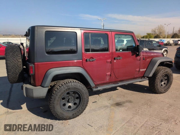 2010 Jeep Wrangler Unlimited Rubicon with VIN 1J4BA6H13AL140902, listed as a Copart auction lot 54335455 with 118,423 mi miles and Clean title. Bid and sale history available at DreamBid. Image 3.