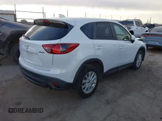 2014 Mazda CX-5 Touring with VIN JM3KE2CY8E0321578, listed as a IAAI auction lot 41769930 with 101,724 mi miles. Bid and sale history available at carsss.com. Image 4.