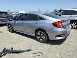 2017 Honda Civic EX-L z VIN 19XFC1F7XHE207946, wystawiony jako Copart lot #58730425 z przebiegiem 58 564 mil mil oraz Szkoda całkowita • Salvage title. Historia ofert i sprzedaży dostępna na DreamBid. Obrazek 2.
