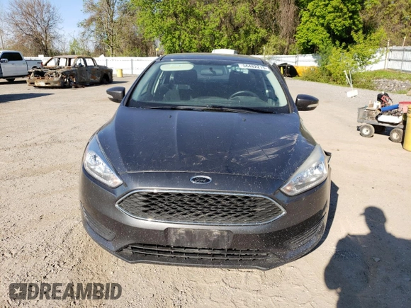 2018 Ford Focus SE z VIN 1FADP3FE4JL306237, wystawiony jako Copart lot #56482215 z przebiegiem 102 241 mil mil oraz Czysty tytuł • Clean title. Historia ofert i sprzedaży dostępna na DreamBid. Obrazek 5.