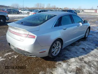 2014 Lincoln MKZ z VIN 3LN6L2G99ER825605, wystawiony jako IAAI lot #41296771 z przebiegiem 195 838 mil mil oraz . Historia ofert i sprzedaży dostępna na DreamBid. Obrazek 4.