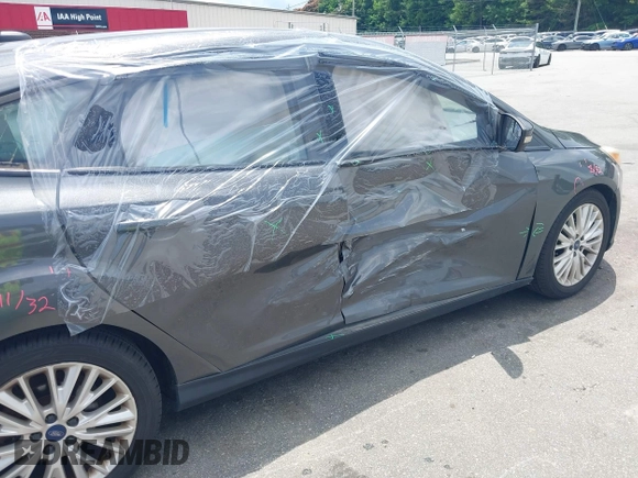 2016 Ford Focus Titanium with VIN 1FADP3N20GL275763, listed as a IAAI auction lot 42511959 with 124,891 mi miles and . Bid and sale history available at DreamBid. Image 6.