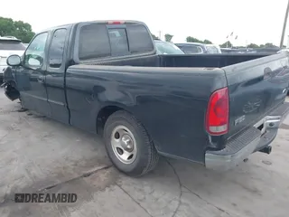2002 Ford F-150 XL with VIN 1FTRX17202NA21470, listed as a IAAI auction lot 42098554 with 149,840 mi miles. Bid and sale history available at carsss.com. Image 3.