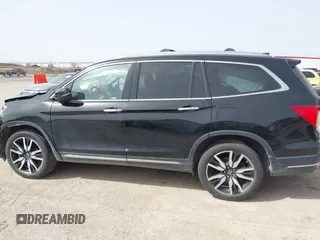 2020 Honda Pilot Touring 8-Passenger with VIN 5FNYF6H91LB003552, listed as a IAAI auction lot 41743685 with 76,725 mi miles and . Bid and sale history available at DreamBid. Image 14.