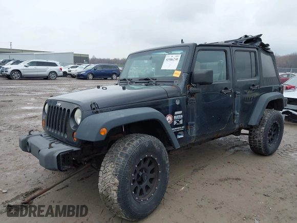 2008 Jeep Wrangler Unlimited X with VIN 1J4GA39138L641138, listed as a IAAI auction lot 41986230 with 215,026 mi miles. Bid and sale history available at carsss.com. Image 2.