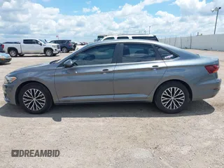 2019 Volkswagen Jetta S z VIN 3VWC57BUXKM061537, wystawiony jako IAAI lot #42170921 z przebiegiem 88 476 mil mil oraz . Historia ofert i sprzedaży dostępna na DreamBid. Obrazek 14.