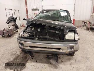 2001 Toyota Tundra SR5 with VIN 5TBRT34131S169696, listed as a IAAI auction lot 41481456 with 215,679 mi miles and . Bid and sale history available at DreamBid. Image 12.