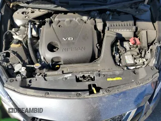 2019 Nissan Maxima Platinum z VIN 1N4AA6AV0KC367101, wystawiony jako Copart lot #46715415 z przebiegiem 68 567 mil mil oraz Szkody całkowita. Historia ofert i sprzedaży dostępna na DreamBid. Obrazek 13.