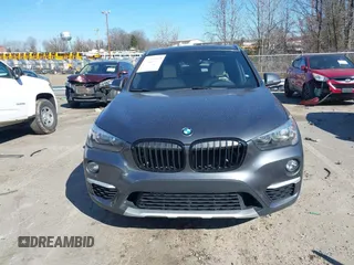 2018 BMW X1 xDrive28i z VIN WBXHT3C31J3H31737, wystawiony jako IAAI lot #41698670 z przebiegiem 68 017 mil mil oraz . Historia ofert i sprzedaży dostępna na DreamBid. Obrazek 13.