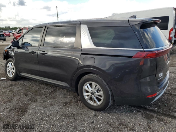 2023 Kia Carnival LX with VIN KNDNB4H38P6255833, listed as a Copart auction lot 86990124 with 6,818 mi miles and Salvage Title. Bid and sale history available at carsss.com. Image 2.