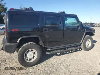 2003 Hummer H2 with VIN 5GRGN23UX3H136571, listed as a Copart auction lot 80823054 with 220,003 mi miles and Salvage Title. Bid and sale history available at carsss.com. Image 3.