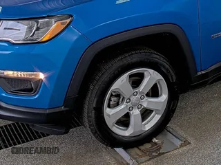 2021 Jeep Compass Latitude with VIN 3C4NJDBB0MT594087, listed as a IAAI auction lot 42791550 with 78,385 mi miles and . Bid and sale history available at DreamBid. Image 35.
