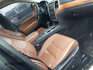 2013 Jeep Grand Cherokee Overland with VIN 1C4RJFCG1DC593890, listed as a IAAI auction lot 41264434 with 204,324 mi miles. Bid and sale history available at carsss.com. Image 5.