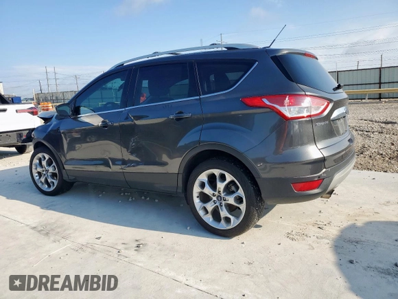 2015 Ford Escape Titanium with VIN 1FMCU0J97FUC88093, listed as a Copart auction lot 60854085 with 64,029 mi miles and Salvage title. Bid and sale history available at DreamBid. Image 2.