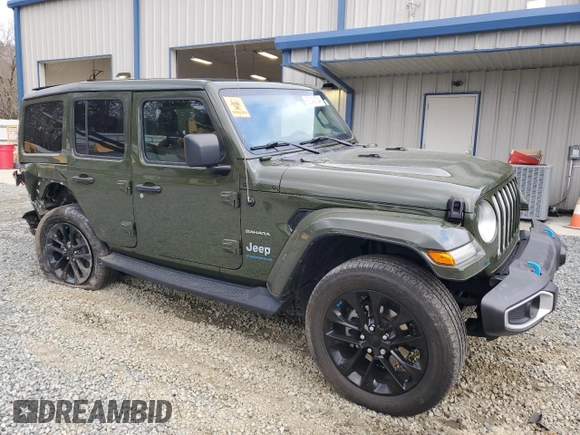 2023 Jeep Wrangler Sahara with VIN 1C4JJXP62PW553101, listed as a Copart auction lot 85543124 with 28,157 mi miles and Salvage Title. Bid and sale history available at DreamBid. Image 4.