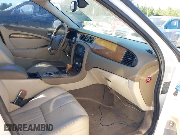 2004 Jaguar S-Type with VIN SAJEA01U74HM96220, listed as a IAAI auction lot 42180627 with 160,015 mi miles and . Bid and sale history available at DreamBid. Image 5.