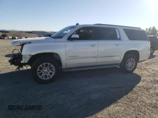 2015 GMC Yukon XL SLT with VIN 1GKS1HKC2FR130964, listed as a Copart auction lot 87796695 with 173,020 mi miles and Salvage Title. Bid and sale history available at carsss.com. Image 1.