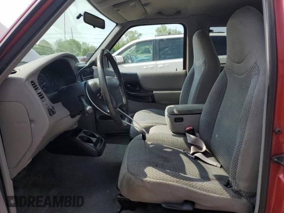 1999 Ford Ranger XL with VIN 1FTYR14V2XPB56627, listed as a Copart auction lot 57036435 with 215,050 mi miles and Salvage title. Bid and sale history available at DreamBid. Image 7.