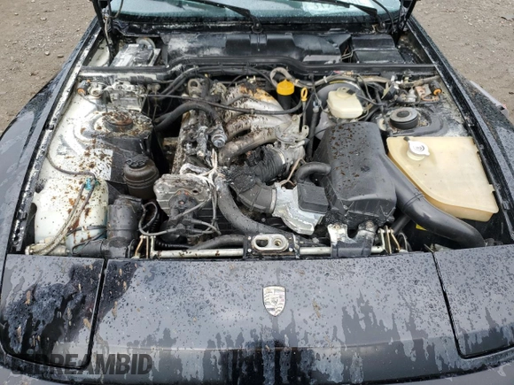 1987 Porsche 944 z VIN WP0AB0946HN474232, wystawiony jako Copart lot #64654684 z przebiegiem 87 126 mil mil oraz Szkoda całkowita • Salvage title. Historia ofert i sprzedaży dostępna na DreamBid. Obrazek 11.