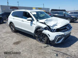 2023 Volkswagen Tiguan SE with VIN 3VVMB7AX4PM128427, listed as a IAAI auction lot 42054477 with 29,731 mi miles and . Bid and sale history available at DreamBid. Image 1.