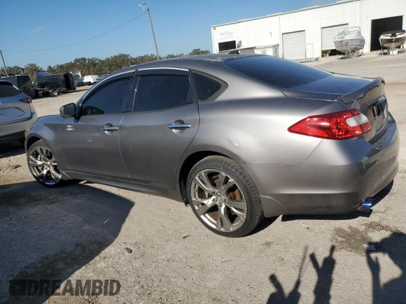 2013 Infiniti M37 with VIN JN1BY1AR9DM604703, listed as a Copart auction lot 77650014 with 104,675 mi miles and Salvage Title. Bid and sale history available at carsss.com. Image 2.