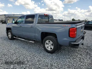 2015 Chevrolet Silverado 1500 LT with VIN 3GCUKREC8FG284565, listed as a Copart auction lot 52760805 with 128,501 mi miles and Salvage Title. Bid and sale history available at DreamBid. Image 2.