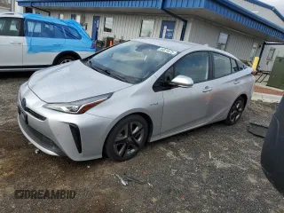 2019 Toyota Prius L Eco z VIN JTDKARFU2K3096168, wystawiony jako Copart lot #54874875 z przebiegiem 96 675 mil mil oraz Szkoda całkowita • Salvage title. Historia ofert i sprzedaży dostępna na DreamBid. Obrazek 1.