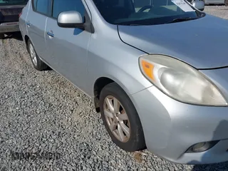 2012 Nissan Versa SV with VIN 3N1CN7APXCL867337, listed as a IAAI auction lot 42079349 with 260,442 mi miles. Bid and sale history available at carsss.com. Image 12.
