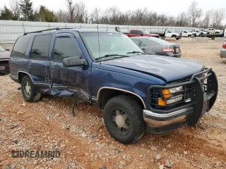 1999 GMC Yukon with VIN 1GKEC13R1XJ812283, listed as a Copart auction lot 42503585 with 226,168 mi miles and Salvage Title. Bid and sale history available at carsss.com. Image 4.
