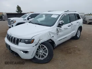 2020 Jeep Grand Cherokee Laredo E with VIN 1C4RJEAG4LC245884, listed as a IAAI auction lot 42564754 with 63,356 mi miles and . Bid and sale history available at DreamBid. Image 6.