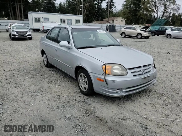 2005 Hyundai Accent GLS z VIN KMHCG45C75U639281, wystawiony jako Copart lot #54887095 z przebiegiem 136 090 mil mil oraz Szkoda całkowita • Salvage title. Historia ofert i sprzedaży dostępna na DreamBid. Obrazek 13.