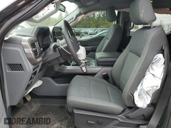 2024 Ford F-150 Lightning XLT z VIN 1FTVW3LK0RWG05326, wystawiony jako Copart lot #55842435 z przebiegiem 23 914 mil mil oraz Czysty tytuł • Clean title. Historia ofert i sprzedaży dostępna na DreamBid. Obrazek 7.