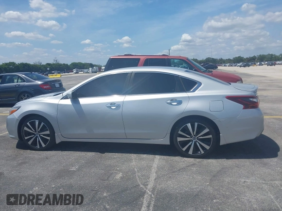 2017 Nissan Altima SV with VIN 1N4AL3AP2HC164553, listed as a IAAI auction lot 42215405 with 117,736 mi miles and . Bid and sale history available at DreamBid. Image 14.