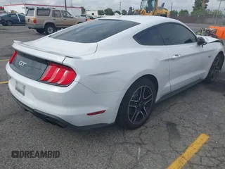 2021 Ford Mustang GT with VIN 1FA6P8CF5M5115597, listed as a IAAI auction lot 42142619 with 101,687 mi miles and . Bid and sale history available at DreamBid. Image 4.