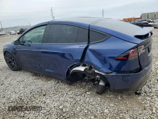 2023 Tesla Model X with VIN 7SAXCDE51PF415778, listed as a Copart auction lot 51792205 with Not Provided miles and Salvage Title. Bid and sale history available at DreamBid. Image 2.