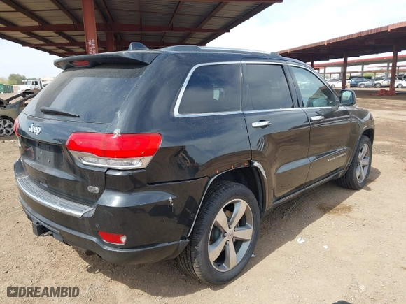 2014 Jeep Grand Cherokee Overland with VIN 1C4RJFCG4EC273786, listed as a IAAI auction lot 41901304 with 73,055 mi miles. Bid and sale history available at carsss.com. Image 4.